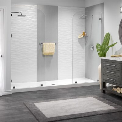 Double faucet open concept shower with tile and marble patterns