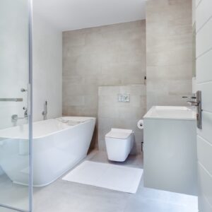 All-white modern bathroom with contour tub