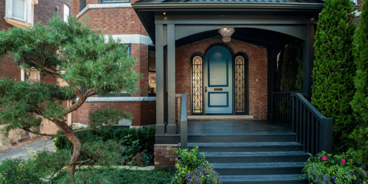 Replacing Your Doors_ Here Are Five Front Door Styles You'll Love Coming Home To - teal door with side windows on brick house