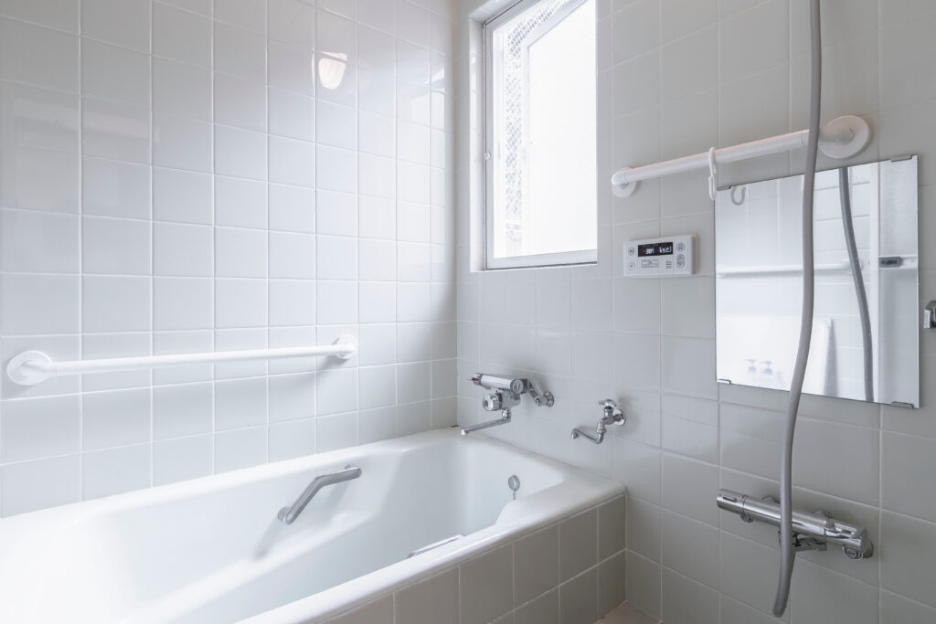 walk-in shower vs. tub-to-shower conversion - a white tub and shower setup