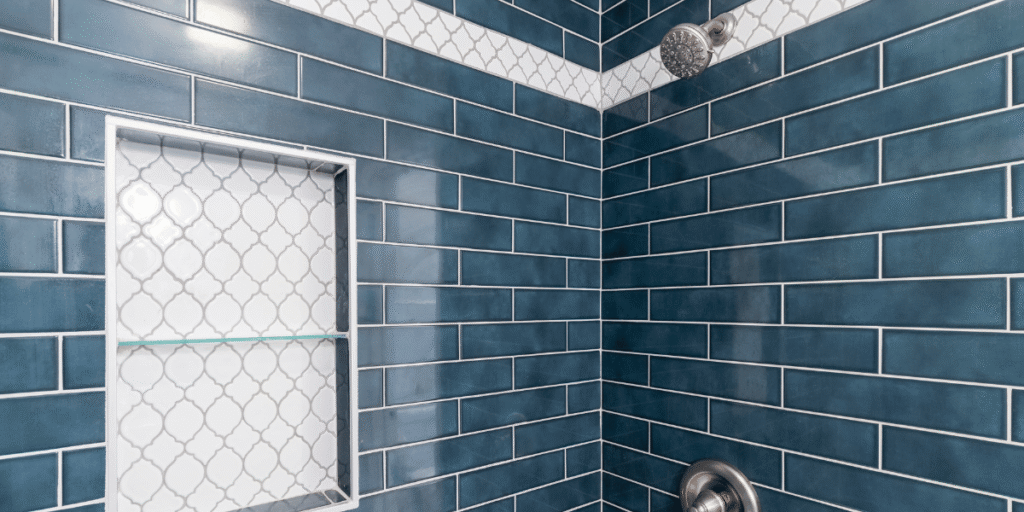 Acrylic vs. Tile Showers An Honest Comparison - blue and white tile shower