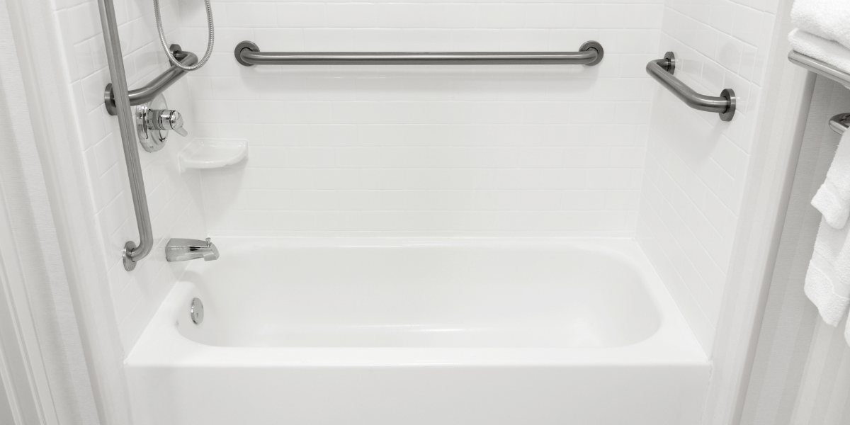 senior bathroom remodel bowling green ky - a bath tub and shower with grab bars