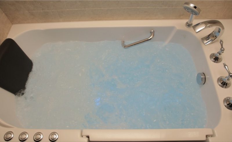 Walk-in tub filled with water