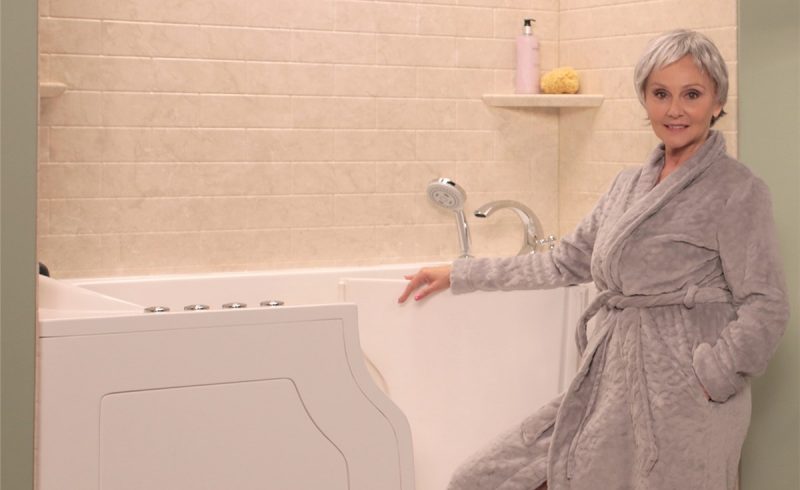 Woman preparing to enter accessible walk-in tub