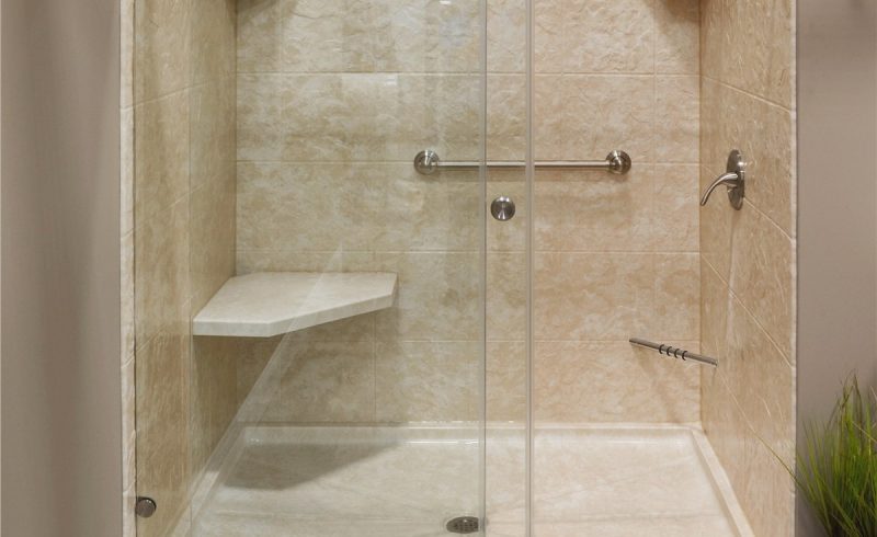 Large shower with bench and double sliding glass doors